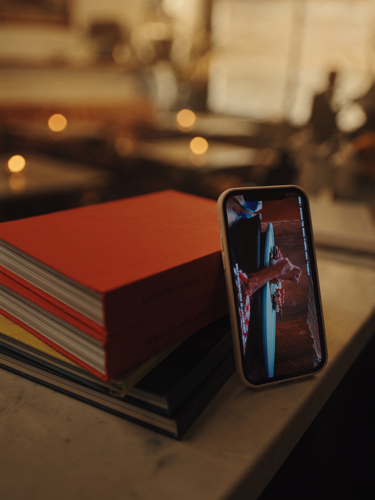 Distribute — phone with content reaching an audience